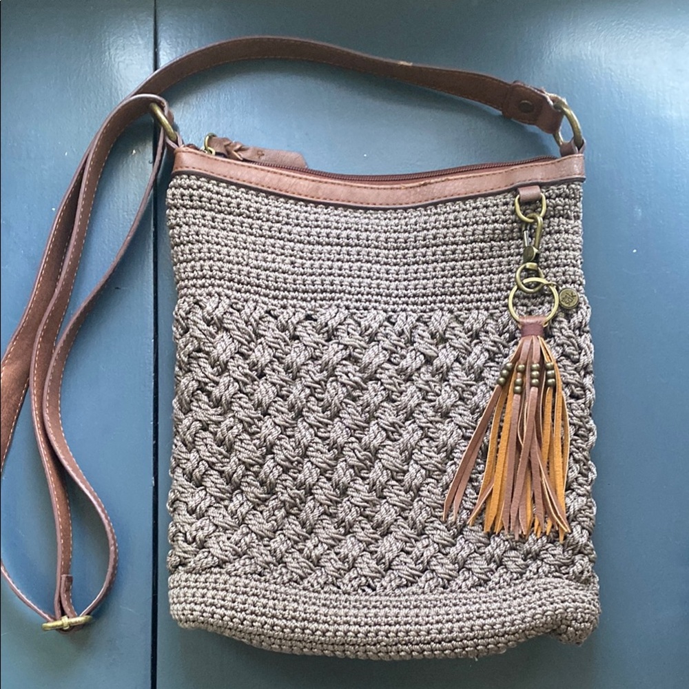 The Sak crochet taupe and brown crossbody boho bag